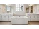 Relaxing primary bathroom with soaking tub, dual vanities, and a separate glass shower at 3350 Backdrop Ct, Castle Rock, CO 80108