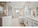 Luxurious bathroom featuring a soaking tub, dual vanities, and a walk-in shower at 3350 Backdrop Ct, Castle Rock, CO 80108