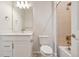 Bright bathroom with modern vanity, sleek fixtures, and a shower-tub combination with tile surround at 3350 Backdrop Ct, Castle Rock, CO 80108