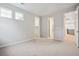 Bright, carpeted bedroom with two windows and walk-in closet offers lots of space at 3350 Backdrop Ct, Castle Rock, CO 80108