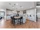 Modern kitchen features white cabinetry, marble countertops, large island, and stainless appliances at 3350 Backdrop Ct, Castle Rock, CO 80108