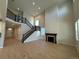 Open-concept living room featuring soaring ceilings and a dark wood burning fireplace at 3350 Backdrop Ct, Castle Rock, CO 80108