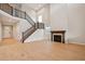 Bright open-concept living room with a fireplace, soaring ceilings, and wood floors at 3350 Backdrop Ct, Castle Rock, CO 80108