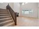 Spacious living room with wood floors, staircase, and natural light at 3350 Backdrop Ct, Castle Rock, CO 80108