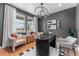 Home office with a dark color scheme, modern lighting, and picture windows with outdoor views at 3350 Backdrop Ct, Castle Rock, CO 80108