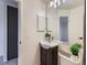 Clean bathroom with a modern vanity, decorative accents and ample lighting at 1699 S Trenton St # 172, Denver, CO 80231