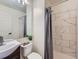 Updated bathroom with marble-look tile and contemporary fixtures at 1699 S Trenton St # 172, Denver, CO 80231