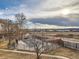 Aerial view of the community pool, the cabana, adjacent to the open field and residential buildings at 1699 S Trenton St # 172, Denver, CO 80231