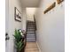 Inviting entryway featuring a staircase, coat rack, and a 