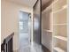 Hallway view with closet and view of bedroom, offers ample storage and organization at 1699 S Trenton St # 172, Denver, CO 80231