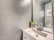 Chic powder room featuring a stylish vanity, elegant sink, and trendy decor, making it both functional and aesthetically pleasing at 1699 S Trenton St # 172, Denver, CO 80231