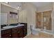 This bathroom offers double sinks, tile flooring, and a walk-in shower at 303 Inverness Way # 201, Englewood, CO 80112