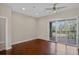 Bedroom with sliding doors to a balcony and ceiling fan at 303 Inverness Way # 201, Englewood, CO 80112
