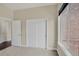 Bedroom with a closet, a window and carpeted floor at 303 Inverness Way # 201, Englewood, CO 80112