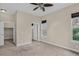Bedroom featuring neutral walls, carpet, ceiling fan, a closet and a bright window view at 303 Inverness Way # 201, Englewood, CO 80112