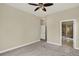 Bedroom featuring neutral walls, carpet, ceiling fan, an ensuite bathroom and a closet at 303 Inverness Way # 201, Englewood, CO 80112