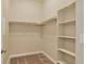 Walk-in closet with carpeted floor, shelving, and hanging racks at 303 Inverness Way # 201, Englewood, CO 80112