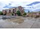 Attractive condo building with brick accents, individual garages, and a well-maintained, welcoming atmosphere at 303 Inverness Way # 201, Englewood, CO 80112