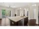 Modern kitchen features a granite island with a stainless steel sink and appliances at 303 Inverness Way # 201, Englewood, CO 80112