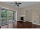 Living room with sliding glass door to a balcony and fireplace at 303 Inverness Way # 201, Englewood, CO 80112