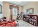 Cozy bedroom with an inversion table and book shelves, offering a versatile space for relaxation at 10968 Macon St, Commerce City, CO 80640