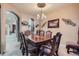 Elegant dining room with a large wooden table, ornate chairs, and a decorative chandelier at 10968 Macon St, Commerce City, CO 80640