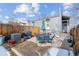 Backyard patio offers a perfect space for outdoor gatherings with a grill, furniture and a spacious stone patio at 1038 E 4Th Ave, Denver, CO 80218