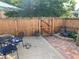 Backyard with a patio, dining area, lush landscaping and a water feature at 1038 E 4Th Ave, Denver, CO 80218