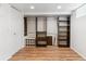 Spacious walk-in closet with custom shelving, rods, and drawers for ample storage and organization at 1038 E 4Th Ave, Denver, CO 80218