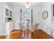 Dining room features a glass table with seating for four and window views at 1038 E 4Th Ave, Denver, CO 80218