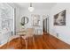 Bright dining area featuring hardwood floors and an adjacent serving counter at 1038 E 4Th Ave, Denver, CO 80218