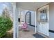 Cozy covered front porch with seating, perfect for enjoying the outdoors at 1038 E 4Th Ave, Denver, CO 80218