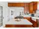 Kitchen featuring a gas range, island, and ample cabinet space at 1038 E 4Th Ave, Denver, CO 80218