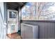 Cozy screened front porch with a storm door, metal cabinet, and grey painted trim at 1038 E 4Th Ave, Denver, CO 80218
