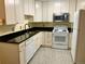 Modern apartment kitchen with white cabinets and stainless steel appliances at 3124 S Wheeling Way # 102, Aurora, CO 80014