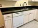 Apartment kitchen showcasing white cabinets and modern appliances at 3124 S Wheeling Way # 102, Aurora, CO 80014