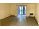 Spacious apartment living room with new wood flooring and a large window at 3124 S Wheeling Way # 102, Aurora, CO 80014