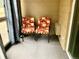 Cozy outdoor patio space featuring two chairs for relaxing and enjoying the fresh air at 3124 S Wheeling Way # 102, Aurora, CO 80014