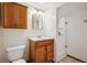 Bathroom featuring a wood vanity, a white toilet, and a shower with glass doors at 25808 Sunrise Ln, Golden, CO 80401