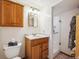 Bathroom featuring a wood vanity and glass-enclosed shower at 25808 Sunrise Ln, Golden, CO 80401