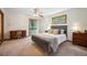 Well lit bedroom with desk, backyard access, and mountain views at 25808 Sunrise Ln, Golden, CO 80401