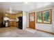Charming kitchen with stainless steel appliances, wooden cabinets, and a view to the trees outside at 25808 Sunrise Ln, Golden, CO 80401