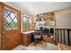 A cozy office space with built-in bookshelves and a charming wooden door at 25808 Sunrise Ln, Golden, CO 80401