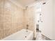 Bathroom featuring a shower-tub combination with decorative tile surround and a light-colored vanity at 14066 E Stanford Cir # H08, Aurora, CO 80015