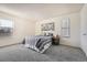 Cozy bedroom with ample natural light from two windows, creating a relaxing and inviting atmosphere at 14066 E Stanford Cir # H08, Aurora, CO 80015