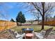 Outdoor area showcases a stone fire pit, seating, and a view of the open landscape at 6725 Lionshead Pkwy, Lone Tree, CO 80124