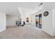 Finished basement featuring neutral walls, soft carpeting, and a sliding glass door at 6725 Lionshead Pkwy, Lone Tree, CO 80124