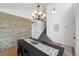 Dining room with decorative lighting, staircase, stone accent wall, and hardwood floors at 6725 Lionshead Pkwy, Lone Tree, CO 80124