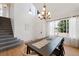 Bright dining room with natural light, hardwood floors, and modern chandelier at 6725 Lionshead Pkwy, Lone Tree, CO 80124