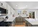 Bright kitchen featuring quartz countertops, subway tile backsplash, and stainless steel appliances at 6725 Lionshead Pkwy, Lone Tree, CO 80124